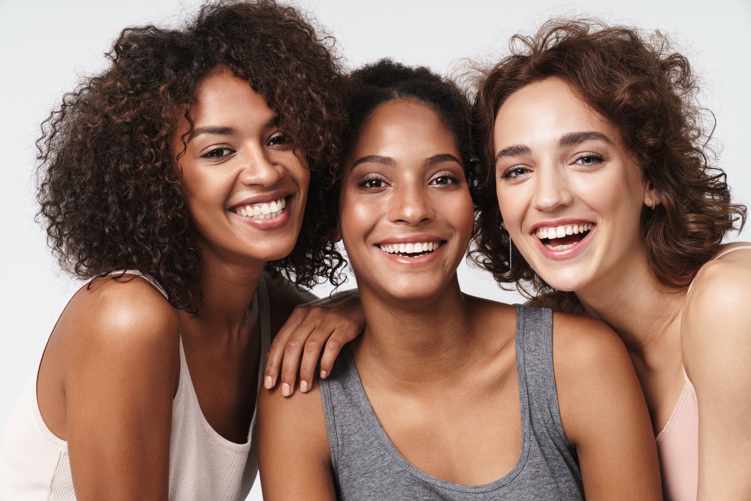 Three women smiling.