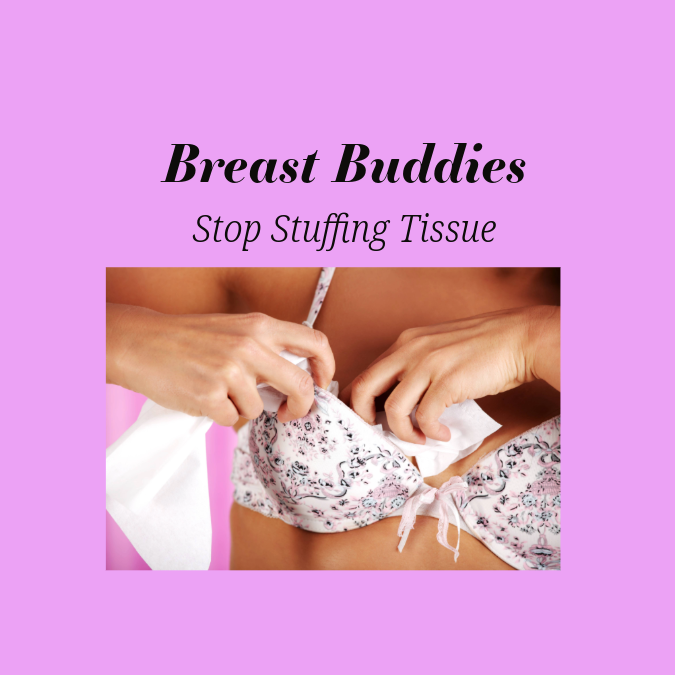 Woman stuffing bra with tissue, towel, and pads.